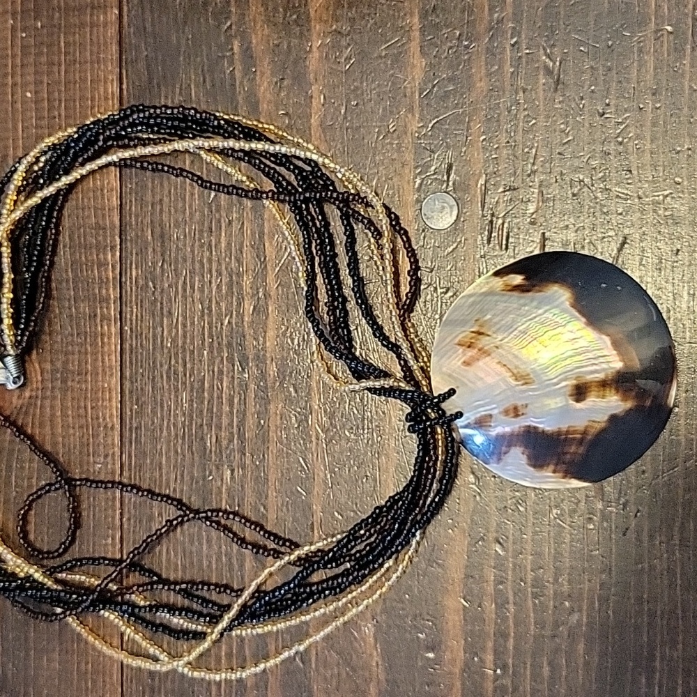 Bead necklace with shell pendant